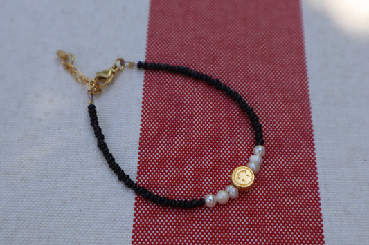 Armband: gouden smiley - zwart